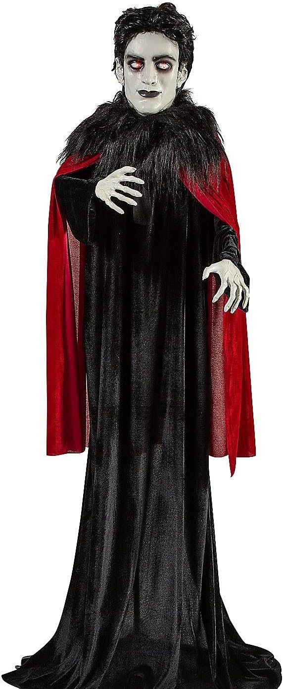 Standing vampire zombie figure in a black and red cape