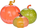 Three inflatable light-up pumpkins in orange and green