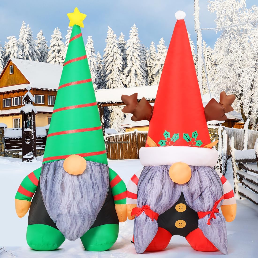 Two inflatable Christmas gnomes in tall green and red hats in the snow