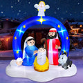 Inflatable nativity with a blue arch, an angel on top and the Holy Family
