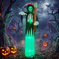 Tall inflatable grim reaper with a green glowing face and a scythe