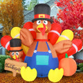 Inflatable turkey in overalls and a pilgrim hat with pumpkins and a sign