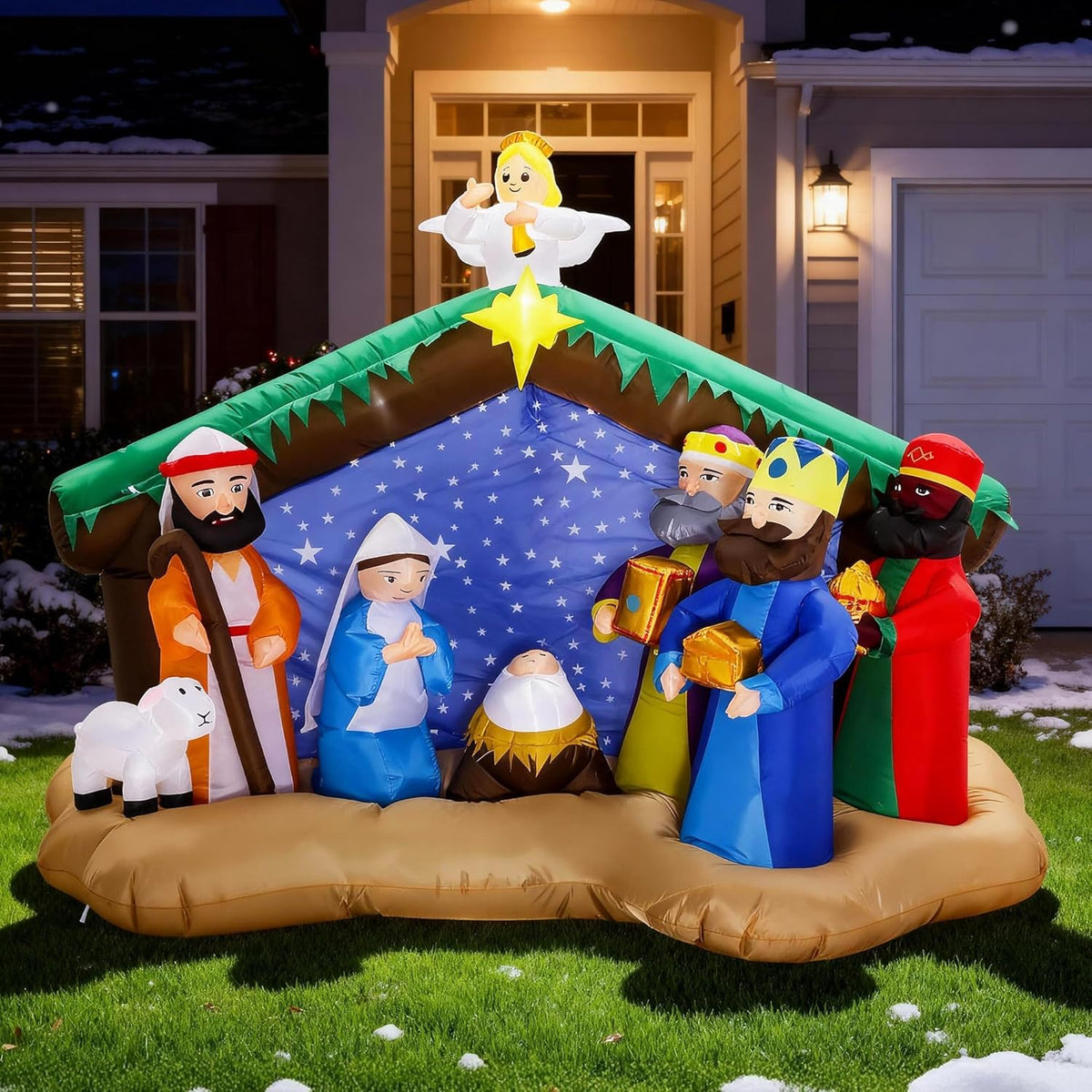 Inflatable nativity with the Holy Family and wise men under a stable with a star