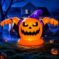 Giant inflatable jack-o'-lantern monster in a purple witch hat with arms spread