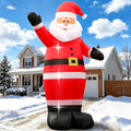 Giant inflatable Santa waving in front of a house on a sunny day