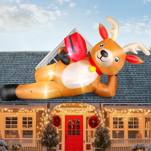 Giant inflatable reindeer lying on a roof with a gift box
