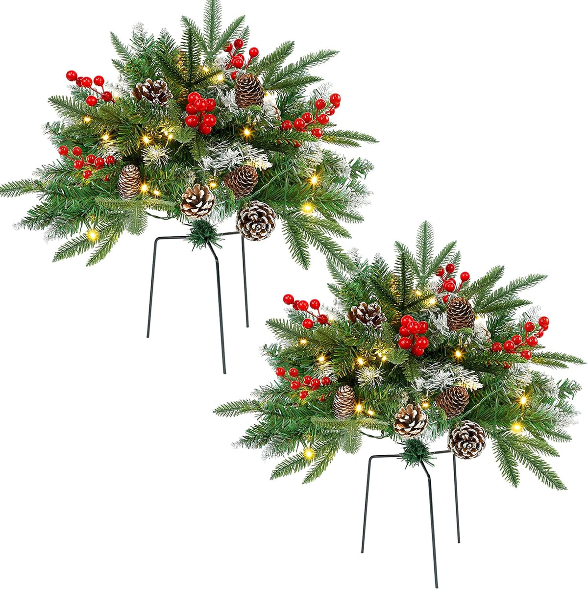 Two lighted faux pine urn fillers with red berries and pinecones