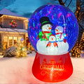 Inflatable snow globe with a snowman family on a red base