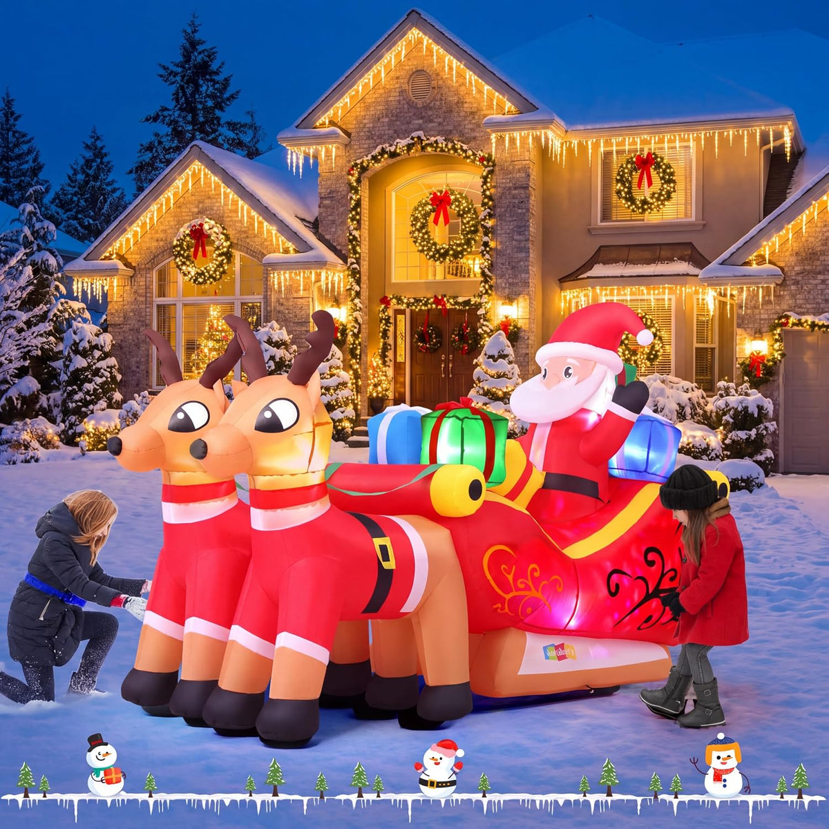 Inflatable Santa in a sled with two reindeer and gifts in a snowy yard